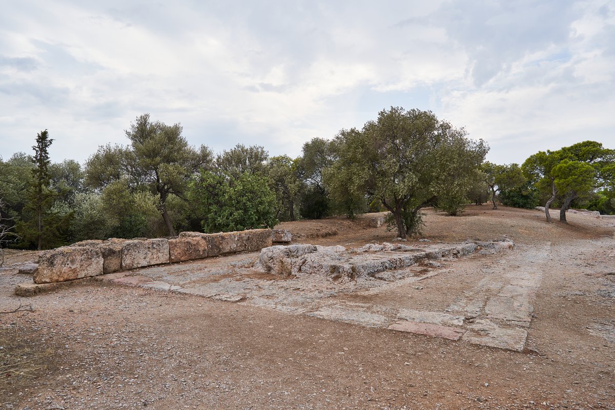 Remains of an unfinished stoa on the Pnyx hill in Athens with blue sky
