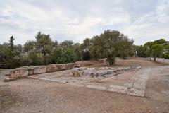 Remains of an unfinished stoa on the Pnyx hill in Athens with blue sky