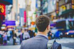 Times Square bustling with crowds and illuminated billboards in New York City
