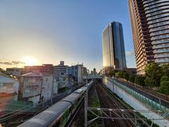 Yamanote line train passing under Daimarukosen bridge in Tokyo