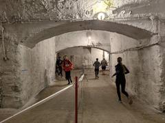 Runners participating in BBU Halloween Run 2024 in Budapest's Kőbányai cellar system