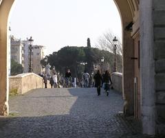 Milvian Bridge in Rome at sunset with historic architecture and river