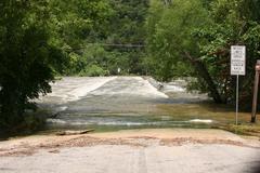 Flood gates open on Mansfield Dam releasing water into Lake Austin, Texas