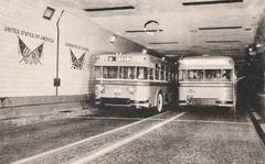 Two buses crossing the Detroit-Windsor Tunnel in a historic black and white postcard from 1945