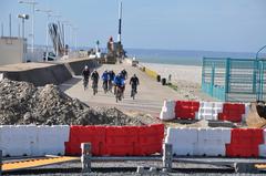 Cyclists riding on the quay at Le Havre, Seine-Maritime