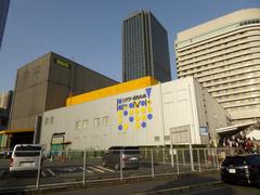 Exterior view of Theater BRAVA! building with modern glass architecture under a clear sky