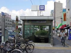 Entrance No. 3 to Taishō Station in Osaka with surrounding buildings and street signs