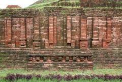 Intricate wall detail below the historic Chaukhandi Stupa showcasing ancient architectural carvings