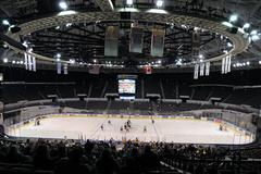 Sailors from Explosive Ordnance Disposal Group 2 and USS Dwight D. Eisenhower playing hockey at Norfolk Scope Arena for Navy Marine Corps Relief Society benefit