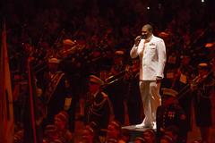 Musician 1st Class Cory Parker singing with the U.S. Navy Band Cruisers during 2017 Virginia International Tattoo grand finale