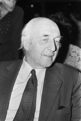 Black and white photograph of Dr. S. Mansholt speaking at the Albert Schweitzer commemoration in Tropenmuseum Amsterdam on November 9, 1974