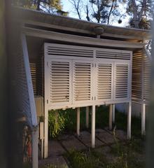 Small fenced garden with meteorological observation instruments at Retiro Meteorological Observatory