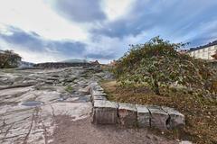 Exterior view of Temppeliaukio Church with rocky surroundings in Helsinki