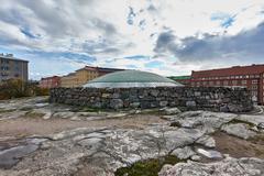 Exterior view of Temppeliaukio Church in Helsinki with a modern architectural design