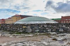 Temppeliaukio Church interior with stone walls and skylight in Helsinki