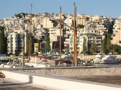 Sunny summer day at a sandy beach near Athens with calm blue sea and distant hills