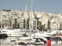 Harbor near Athens with boats and buildings on a sunny day in July 2006