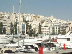Harbor near Athens with boats and buildings on 2006 July 24