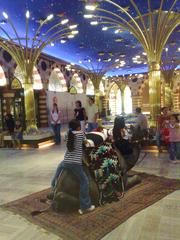 Interior view of The Dubai Mall showing luxurious architectural design and bustling shoppers