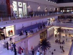 Exterior view of The Dubai Mall patio featuring modern architecture and outdoor seating