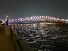 Sabarmati riverfront and Atal Pedestrian Bridge at night with colorful lighting