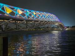 Sabarmati riverfront and Atal Pedestrian Bridge at night with colorful lighting