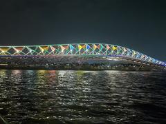 Sabarmati riverfront and Atal Pedestrian Bridge illuminated with colourful lights at night