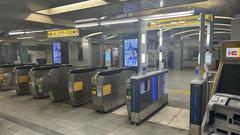 Osaka Metro Honmachi Station entrance with directional signs and escalators