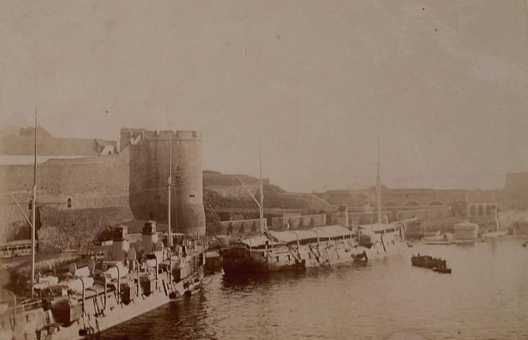 Aerial view of Brest military port with docks, ships and surrounding city