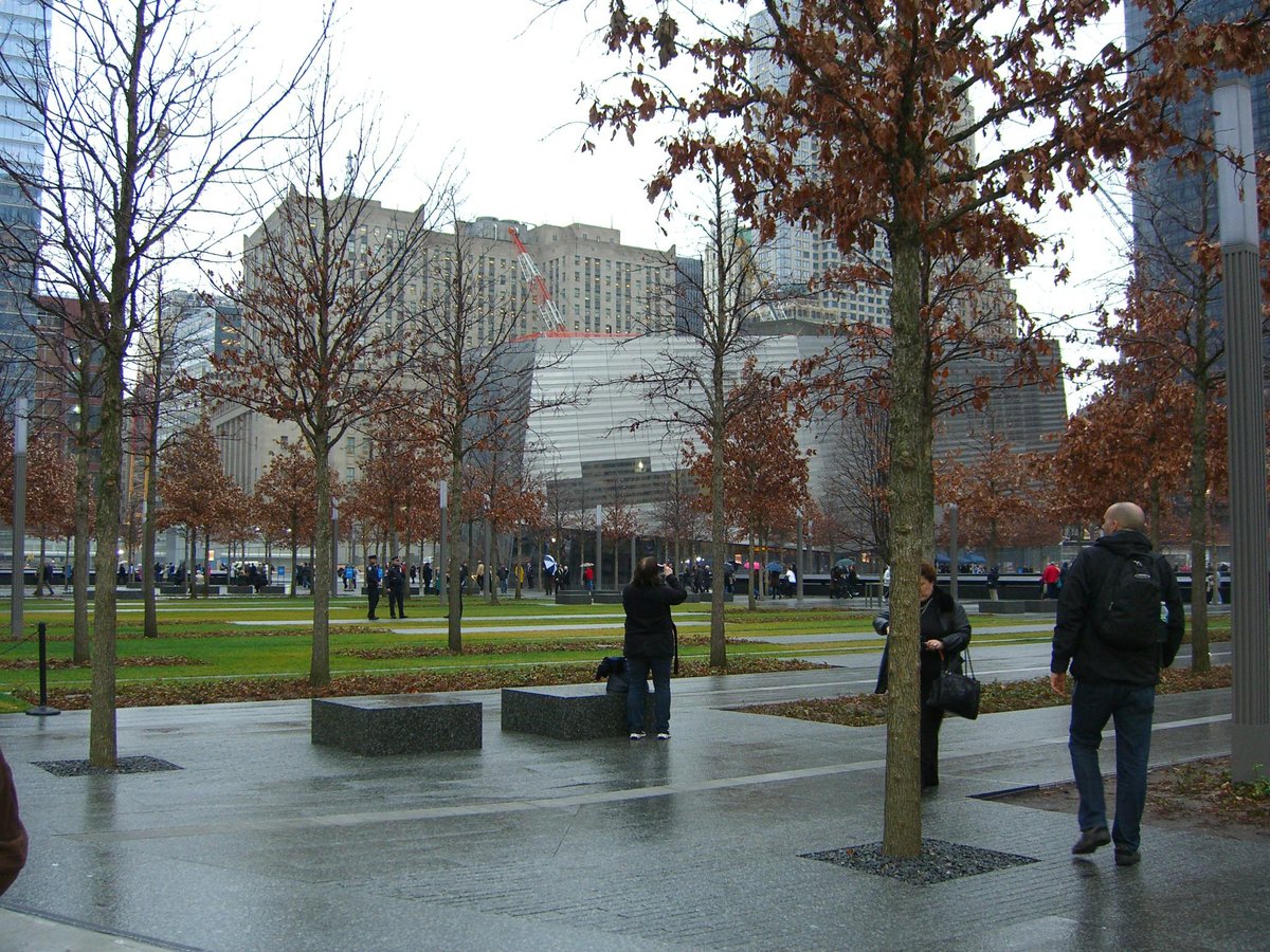 Aerial view of the National September 11 Memorial & Museum in Manhattan featuring the twin reflecting pools, North Pool on the left and South Pool on the right, captured on December 6, 2011