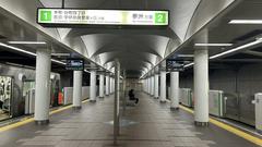 Inside view of Cosmosquare Station on the Osaka Metro Central Line with escalators and modern architecture