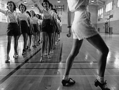 Students practicing tap dancing in gymnasium at Iowa State College