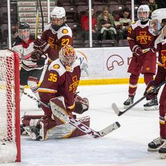 Minot State University Beavers and Iowa State University Cyclones hockey players reacting to a goal during military appreciation game at Maysa Arena