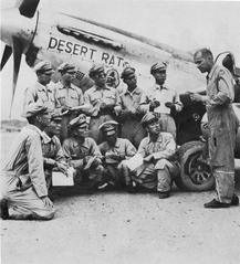 U.S. officer briefing South Korean pilots in military uniforms
