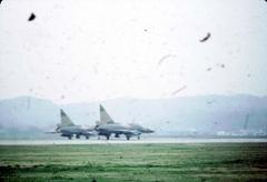 Two F-102 fighter jets of the 51st Fighter-Interceptor Wing ready for takeoff at Itazuke Air Base Japan 1966