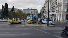 Syntagma Square in Athens with historical buildings and pedestrians