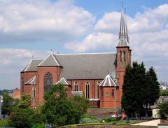 Front view of St Chad's Cathedral in Birmingham with gothic architecture under blue sky