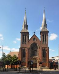 Exterior view of St Chad's Cathedral, a listed building in Birmingham with detailed stone architecture and tall spires