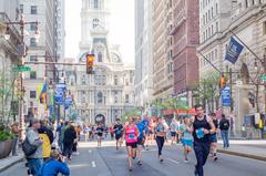 Runners participating in the Broad Street Run marathon on a city street