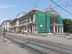 Facade reconstruction of Mahenovo Theatre with scaffolding and workers