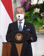 Malaysian Prime Minister Muhyiddin Yassin giving a press statement during state visit to Indonesia at Merdeka Palace in 2021