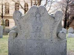 Headstone with carved death's head and angel wings at King's Chapel Burying Ground