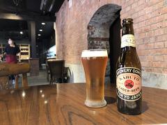 Kabuto Beer bottle on wooden surface with blurred background