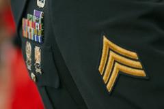 Sgt. Ryan Barger saluting during the National Anthem at a Baltimore Orioles vs Toronto Blue Jays baseball game