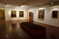 Interior view of the Museu Nacional de Soares dos Reis with paintings displayed on the walls in Porto, Portugal