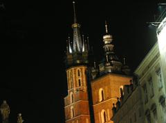 A sunny spring day in Krakow with historic buildings and trees showing early spring foliage