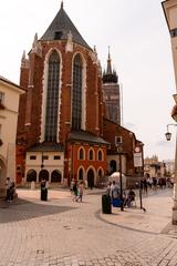 St. Mary's Basilica in Kraków, Poland with its distinct gothic architecture and twin towers against a blue sky