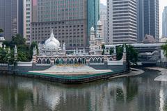 Sultan Abdul Samad Jamek Mosque and Kolam Biru viewed from the bridge along Klang River Kuala Lumpur
