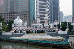 Sultan Abdul Samad Jamek Mosque and Kolam Biru viewed from bridge over Klang River in Kuala Lumpur