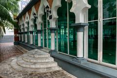 Interior of Sultan Abdul Samad Jamek Mosque with ornate arches and chandelier in Kuala Lumpur